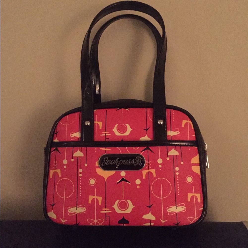 Gently used Sourpuss mini bowler purse atomic